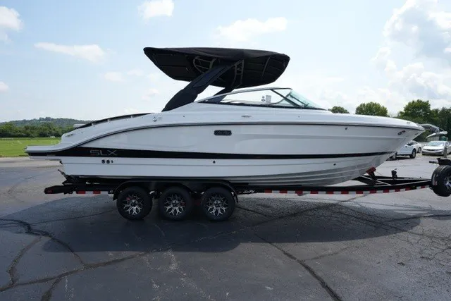 Slide: The Image of 2027 Sea Ray SLX 280 boat on trailer, featuring sleek design and black canopy. - 4