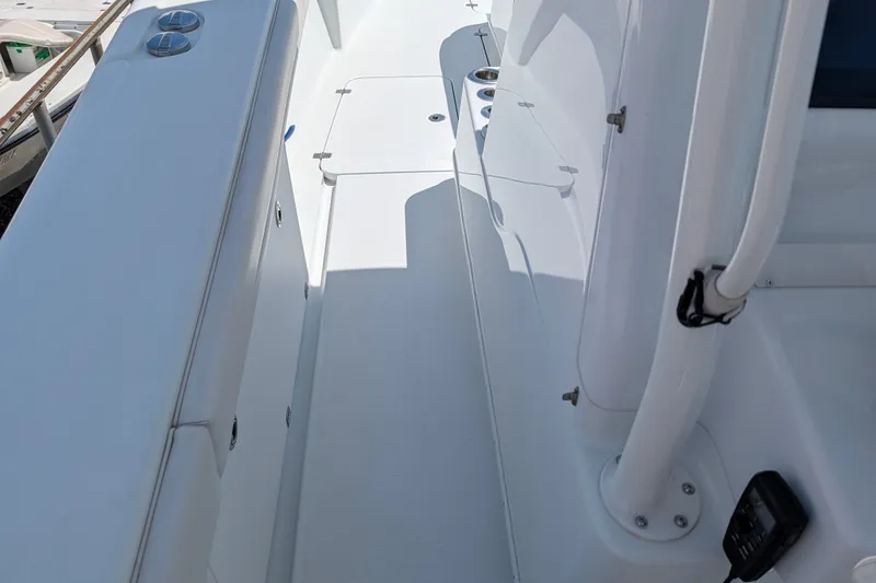 Slide: The Image of 2022 Yellowfin 36 Offshore boat deck with sleek white finish and modern fittings. - 25