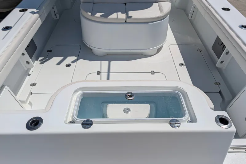 Slide: The Image of 2022 Yellowfin 36 Offshore boat interior with seating and storage compartments. - 8