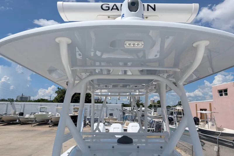 Slide: The Image of 2022 Yellowfin 36 Offshore boat with Garmin radar, docked under clear skies. - 30