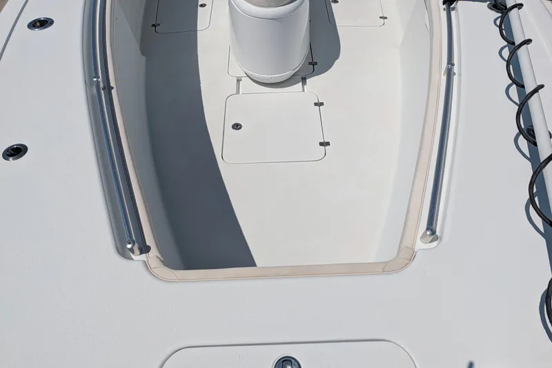 Slide: The Image of 2022 Yellowfin 36 Offshore boat deck with storage compartments and railings. - 45