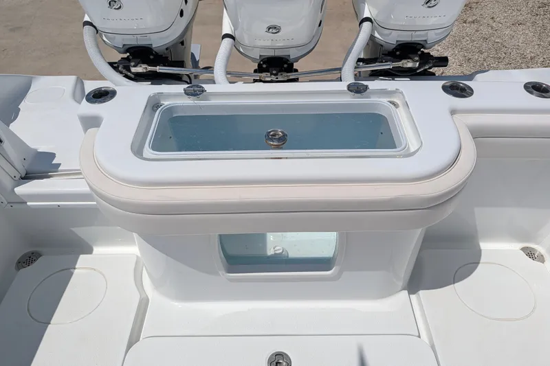 Slide: The Image of 2022 Yellowfin 36 Offshore boat with livewell and triple outboard engines. - 20