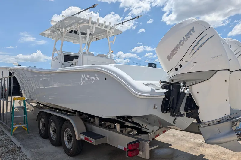 Slide: The Image of 2022 Yellowfin 36 Offshore boat on trailer with Mercury outboard engines. - 7