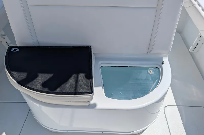 Slide: The Image of 2022 Yellowfin 36 Offshore boat seat with storage compartment and cushion. - 12