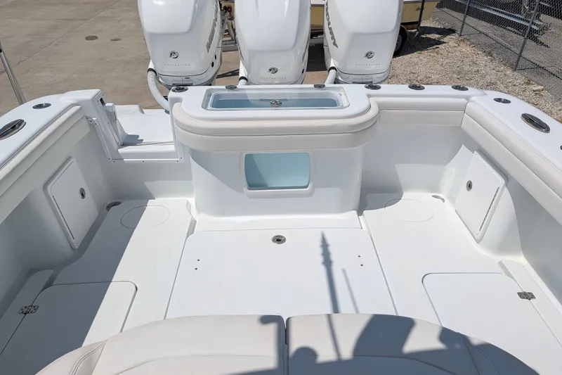 Slide: The Image of 2022 Yellowfin 36 Offshore boat deck with triple outboard engines. - 13