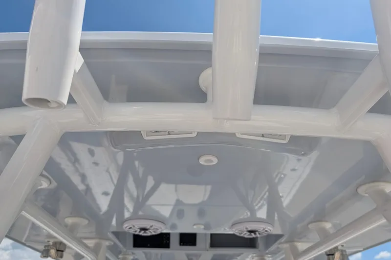 Slide: The Image of 2022 Yellowfin 36 Offshore boat's T-top structure against a clear blue sky. - 23