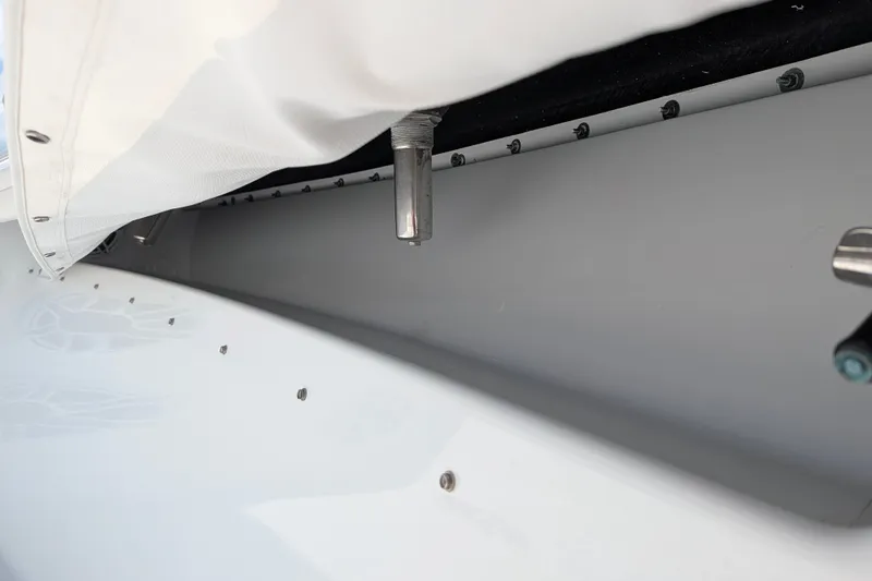 Slide: The Image of Close-up of 2022 Yellowfin 36 Offshore boat detailing, showcasing sleek design and hardware. - 38
