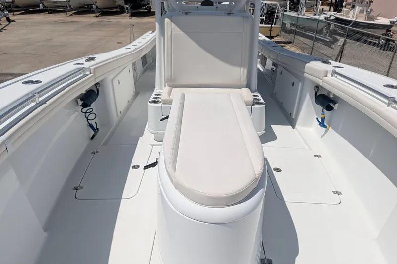 Slide: The Image of 2022 Yellowfin 36 Offshore boat interior with white seating and spacious deck layout. - 33