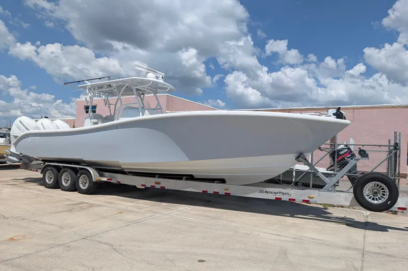 Slide: The Image of 2022 Yellowfin 36 Offshore boat on trailer under a cloudy sky. - 3