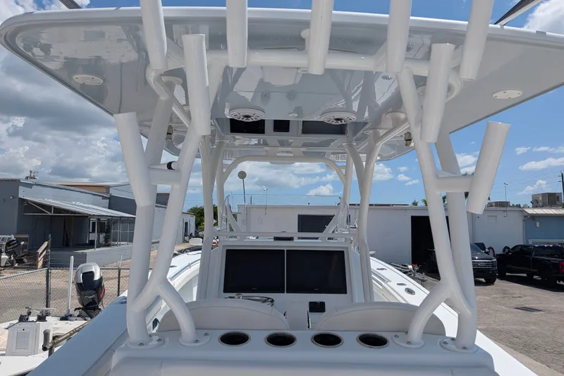 Slide: The Image of 2022 Yellowfin 36 Offshore boat with advanced navigation system and sturdy T-top structure. - 10