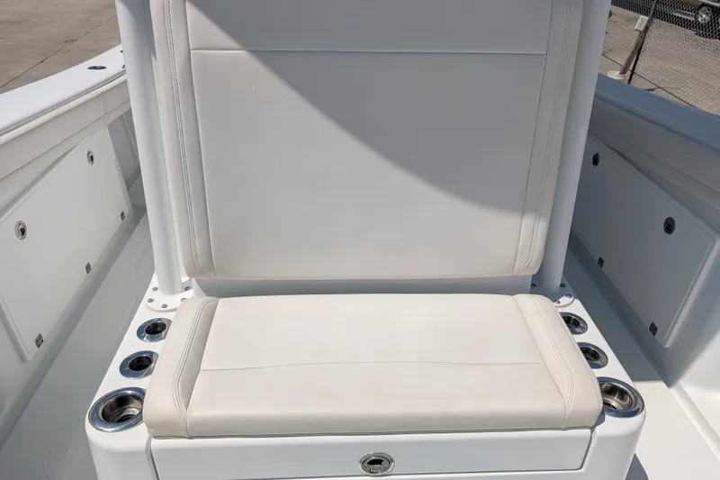 Slide: The Image of 2022 Yellowfin 36 Offshore boat seat with cup holders, white upholstery. - 28