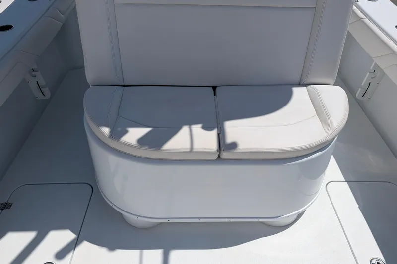 Slide: The Image of 2022 Yellowfin 36 Offshore boat seat with white cushioned upholstery. - 11