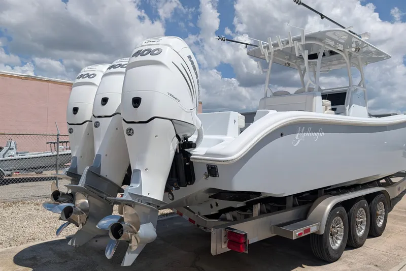 Slide: The Image of 2022 Yellowfin 36 Offshore boat with triple Mercury 400 engines on a trailer. - 5