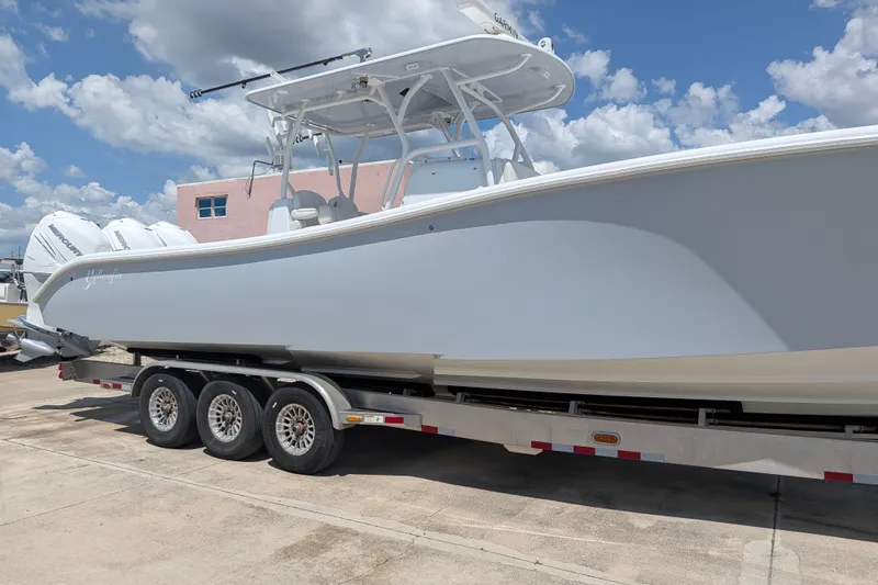 Slide: The Image of 2022 Yellowfin 36 Offshore boat on trailer under blue sky. - 4