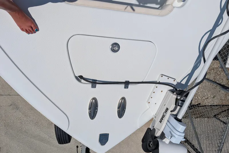 Slide: The Image of 2022 Yellowfin 36 Offshore boat deck with equipment and foot visible. - 43