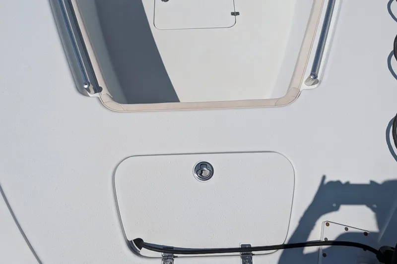 Slide: The Image of 2022 Yellowfin 36 Offshore boat deck with hatch and railing details. - 44