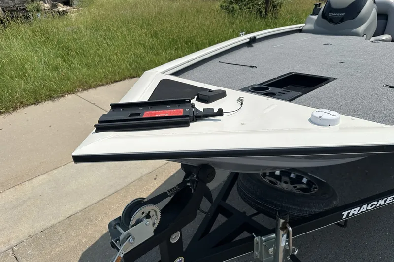 Slide: The Image of 2017 Tracker Pro Team 195 Tournament Edition boat on trailer, showing bow and deck details. - 21