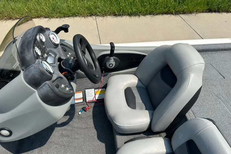 Slide: The Image of 2017 Tracker Pro Team 195 Tournament Edition boat interior with steering wheel and gauges. - 13