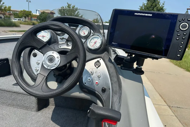 Slide: The Image of Steering console of 2017 Tracker Pro Team 195 Tournament Edition with Humminbird Helix 10. - 15