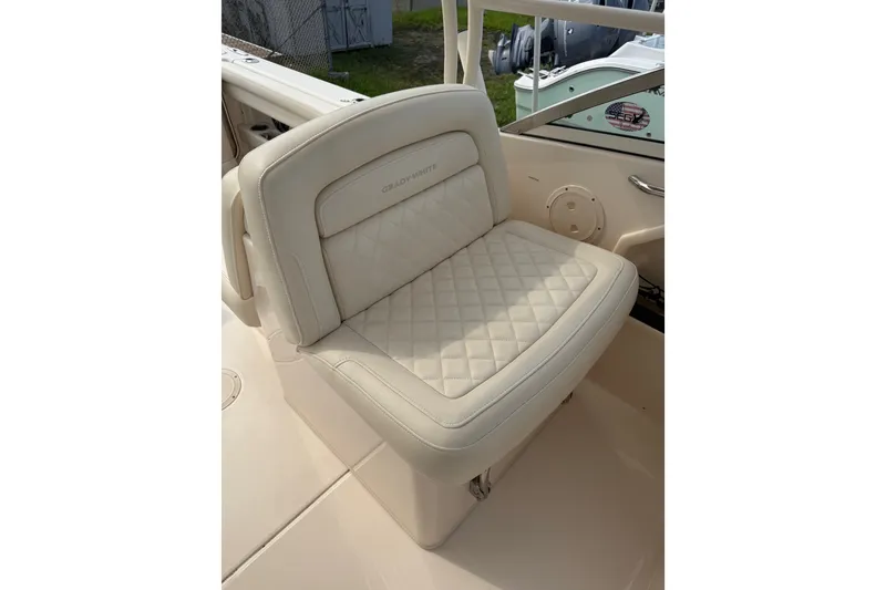 Slide: The Image of 2020 Grady-White Freedom 275 boat seat with quilted upholstery, showcasing luxury and comfort. - 5