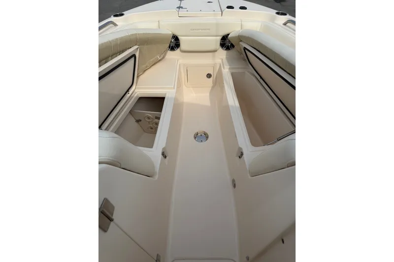 Slide: The Image of 2020 Grady-White Freedom 275 boat interior with spacious seating and storage compartments. - 8