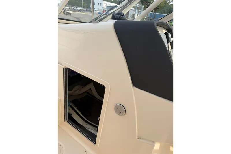 Slide: The Image of 2020 Grady-White Freedom 275 boat interior detail with open storage compartment. - 10