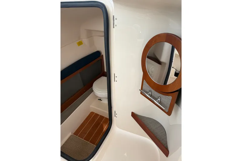 Slide: The Image of 2020 Grady-White Freedom 275 boat interior with toilet and mirror. - 15