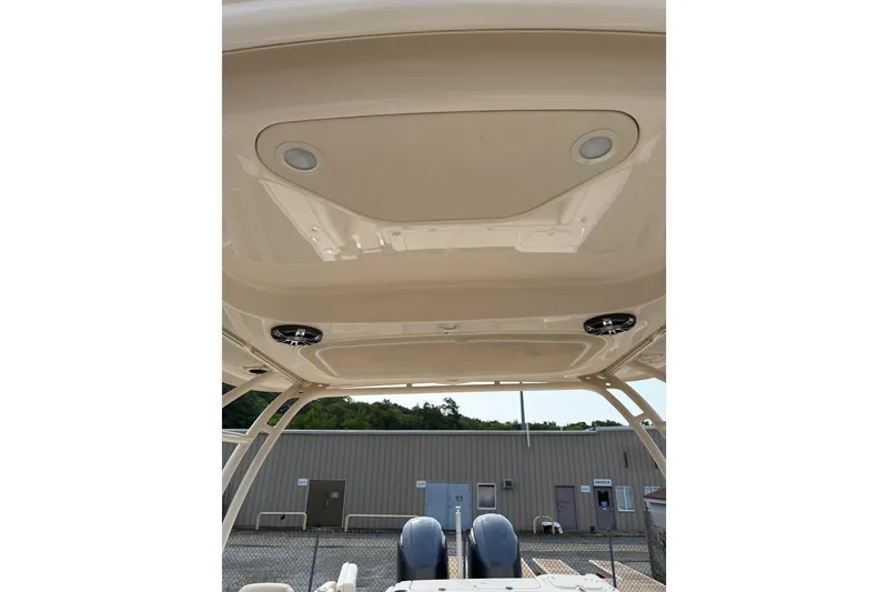 Slide: The Image of 2020 Grady-White Freedom 275 boat hardtop with integrated speakers and lights. - 7