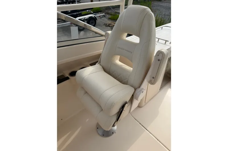 Slide: The Image of Luxury seating on 2020 Grady-White Freedom 275 boat, featuring premium white upholstery. - 6