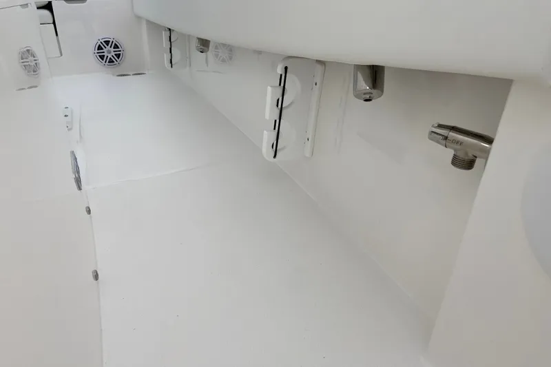 Slide: The Image of Interior view of 2027 Regulator 24XO boat, showcasing sleek white design and fixtures. - 5