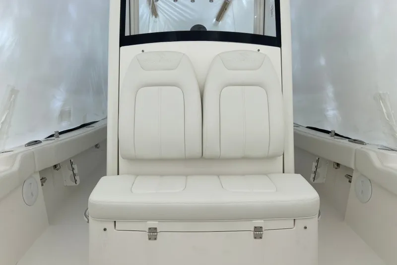 Slide: The Image of 2027 Regulator 24XO boat interior with white cushioned seating and sleek design. - 8