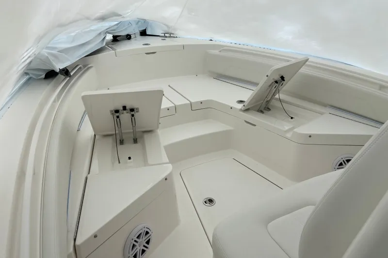 Slide: The Image of 2027 Regulator 24XO boat interior with seating and storage compartments. - 7
