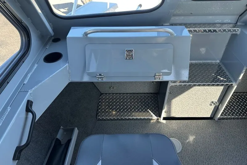 Slide: The Image of Interior of 2026 Hewescraft 240 Ocean Pro ET boat, featuring storage compartments and seating. - 7