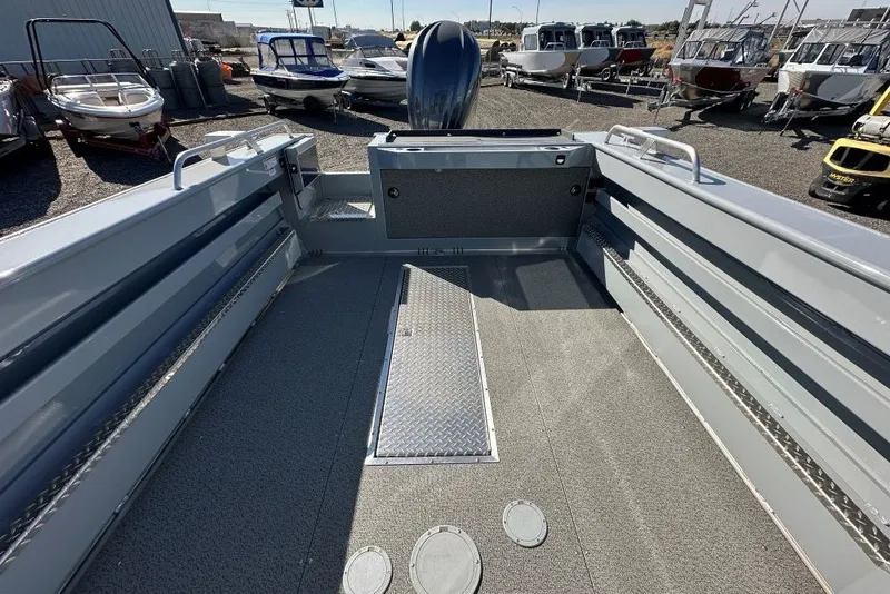 Slide: The Image of 2026 Hewescraft 240 Ocean Pro ET boat interior, showcasing spacious deck and modern design. - 9
