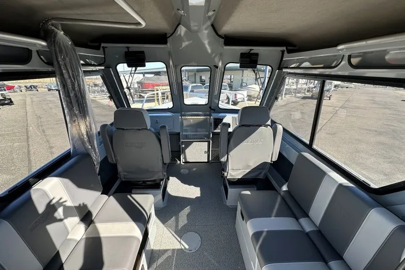 Slide: The Image of Interior of 2026 Hewescraft 240 Ocean Pro ET boat, featuring spacious seating and modern design. - 5