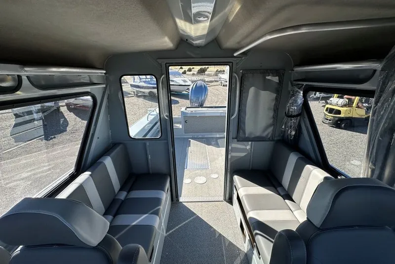 Slide: The Image of Interior of 2026 Hewescraft 240 Ocean Pro ET boat, featuring spacious seating and modern design. - 8