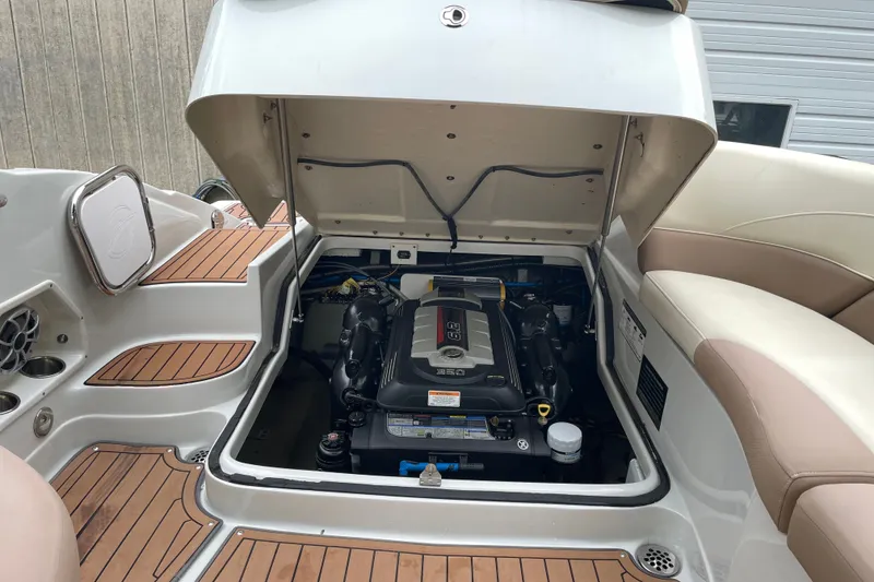 Slide: The Image of Open engine compartment of 2017 Crownline 285 SS boat, showcasing detailed interior components. - 29
