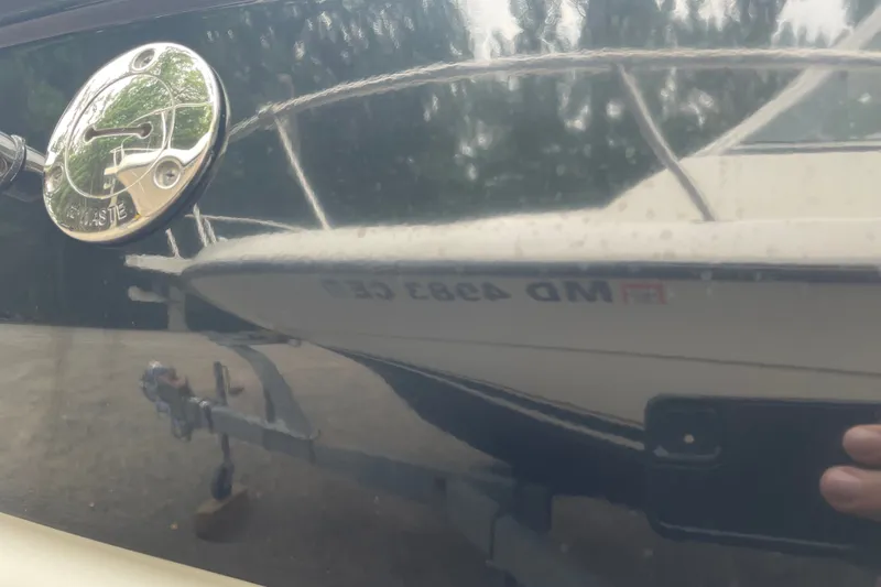 Slide: The Image of Reflection of a 2017 Crownline 285 SS boat on a shiny surface. - 34