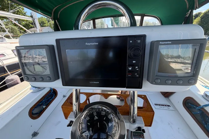 Slide: The Image of Cockpit of 1987 Catalina 34 sailboat with Raymarine navigation equipment. - 19