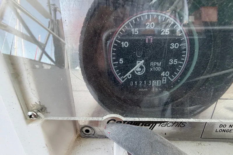 Slide: The Image of Close-up of a Catalina 34 yacht tachometer, showing RPM and engine hours. - 21