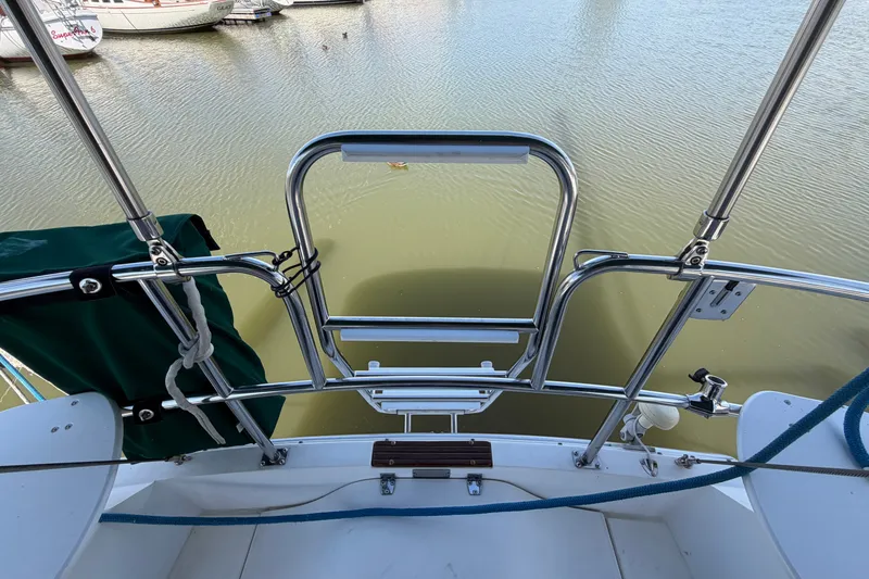 Slide: The Image of Stern view of a 1987 Catalina 34 sailboat with stainless steel railings. - 12