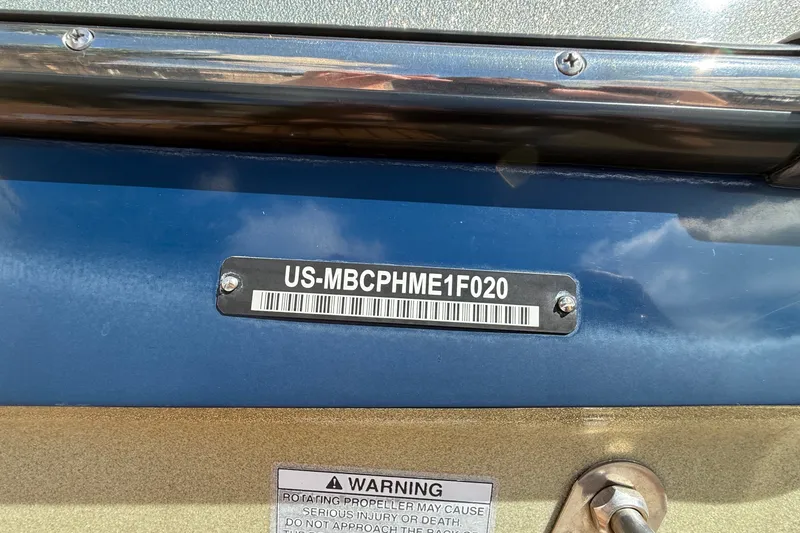 Slide: The Image of 2020 MasterCraft X24 boat identification plate with warning label. - 14