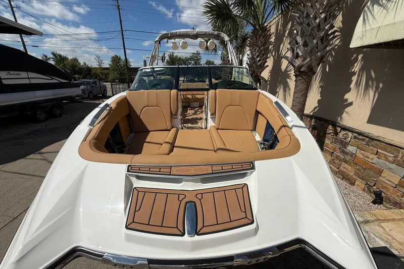 Slide: The Image of 2020 MasterCraft X24 boat with tan seating and sleek white exterior. - 3