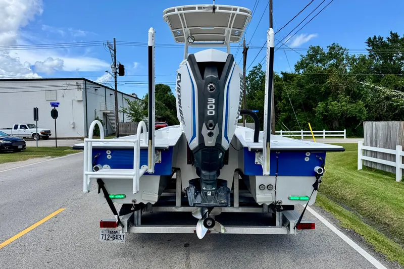 Slide: The Image of 2017 Shallow Sport 25 X3 boat with Evinrude 300 engine on trailer. - 3