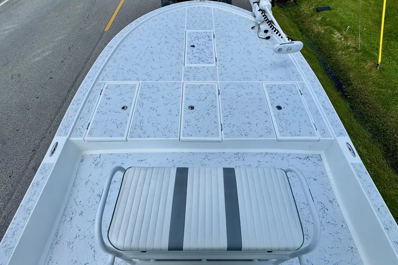 Slide: The Image of 2017 Shallow Sport 25 X3 boat deck with storage compartments and seating. - 13