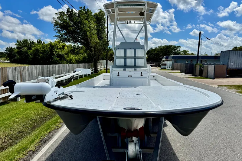 Slide: The Image of 2017 Shallow Sport 25 X3 boat on trailer, sunny day, residential street background. - 6