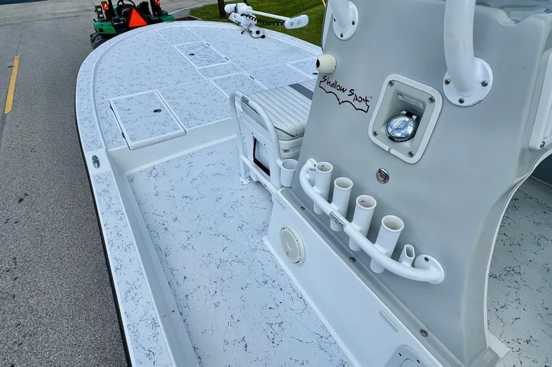Slide: The Image of 2017 Shallow Sport 25 X3 boat deck with rod holders and seating. - 12