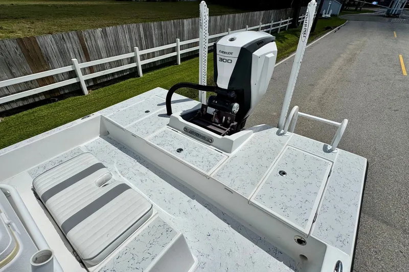 Slide: The Image of 2017 Shallow Sport 25 X3 boat with Evinrude 300 engine, white deck, and seating. - 7