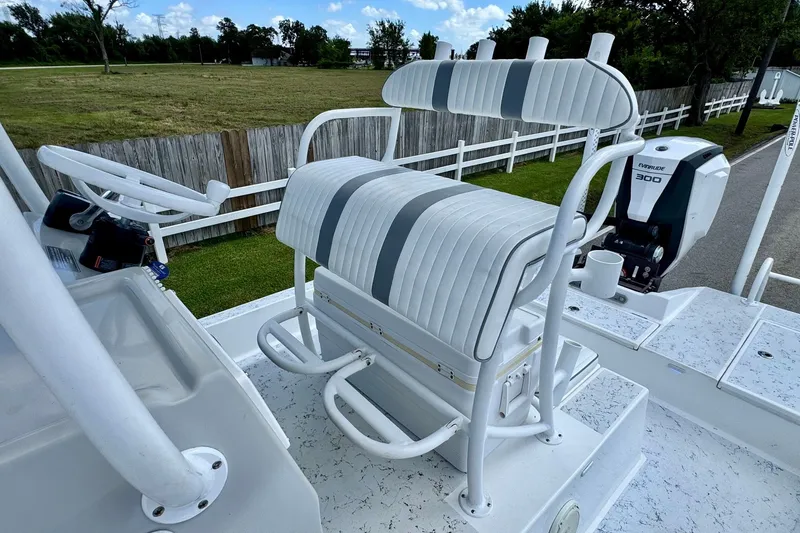 Slide: The Image of 2017 Shallow Sport 25 X3 boat with white seating and Evinrude 300 engine. - 9