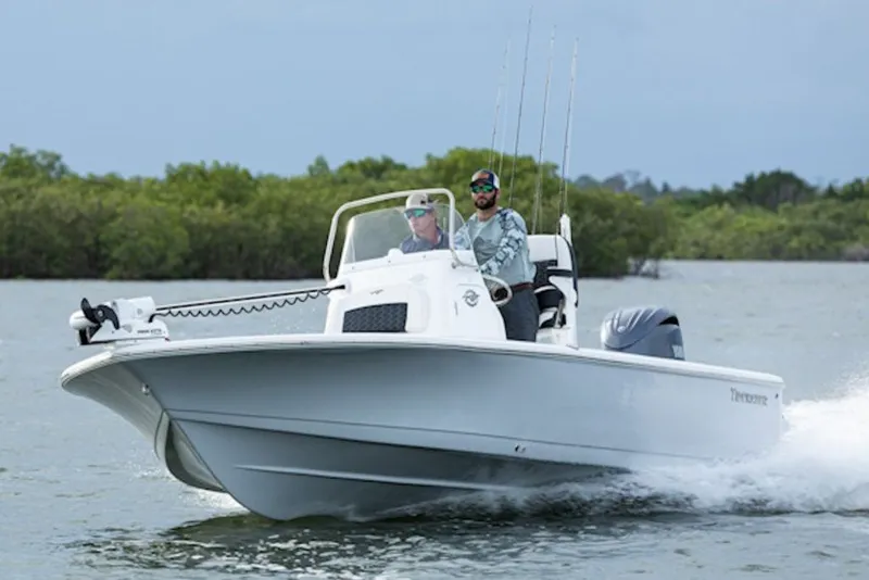 The Image of 2027 Tidewater 2110 Bay Max boat cruising on water with two passengers. - 1